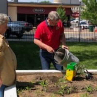 Ray Ladd, Ag Agent, leading gardening project at Mall Towers in Atchison