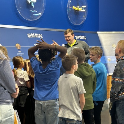 AEHM volunteer sharing the principles of flight!
