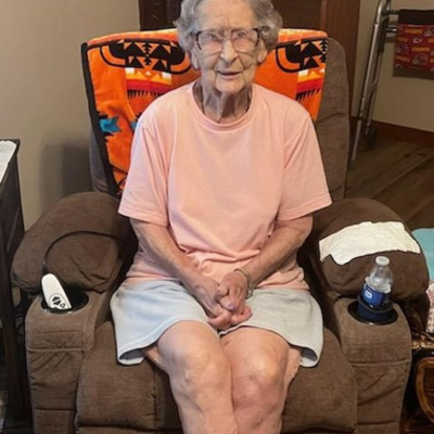 Woman sits in her new lift chair provided by 3Rivers.